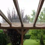 Terrassendach Leimholz mit Glasdach und Sonnenschutz